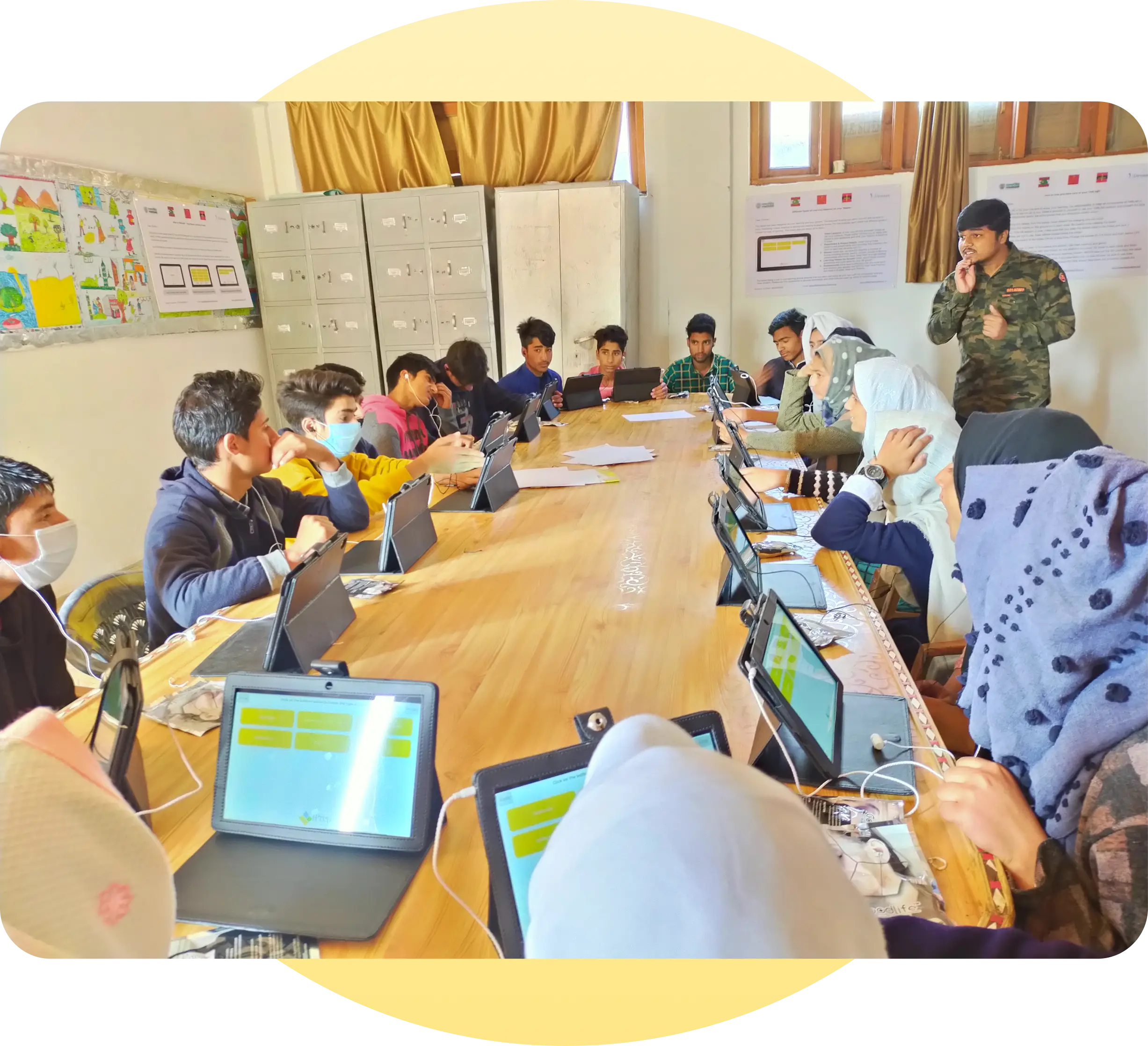 A visual illustrating school students engaged in learning with iPrep learning tablets in classrooms